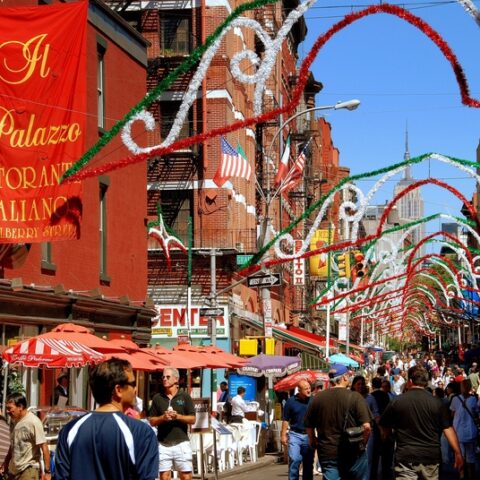 People stroll along mulberry street in the heart of new york city s famed little italy district during the annual san gennaro street festival. © lei xu