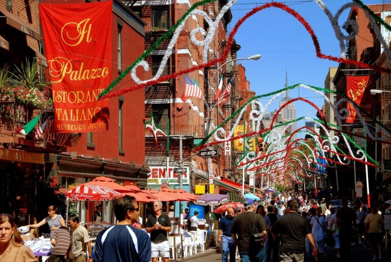 People stroll along mulberry street in the heart of new york city s famed little italy district during the annual san gennaro street festival. © lei xu
