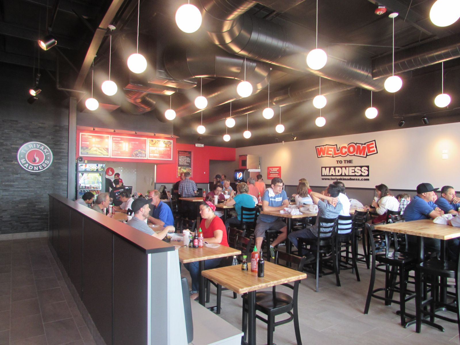 Franchise Industry Veterans Celebrate Opening of Iowa's Newest Teriyaki Madness Shop