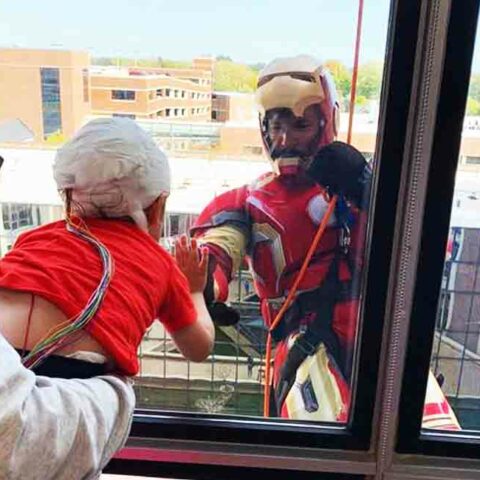 Swat team members rappel down children's hospital dressed as superheroes - photo licensed by shore news network.