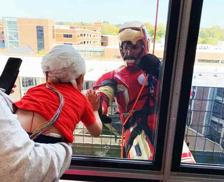 SWAT team members rappel down childrens hospital dressed as superheroes