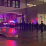 Officers line up at the hospital as the body of Bayonne Police Department Captain Paul Jamolawicz. Captain Jamolawicz is transported.