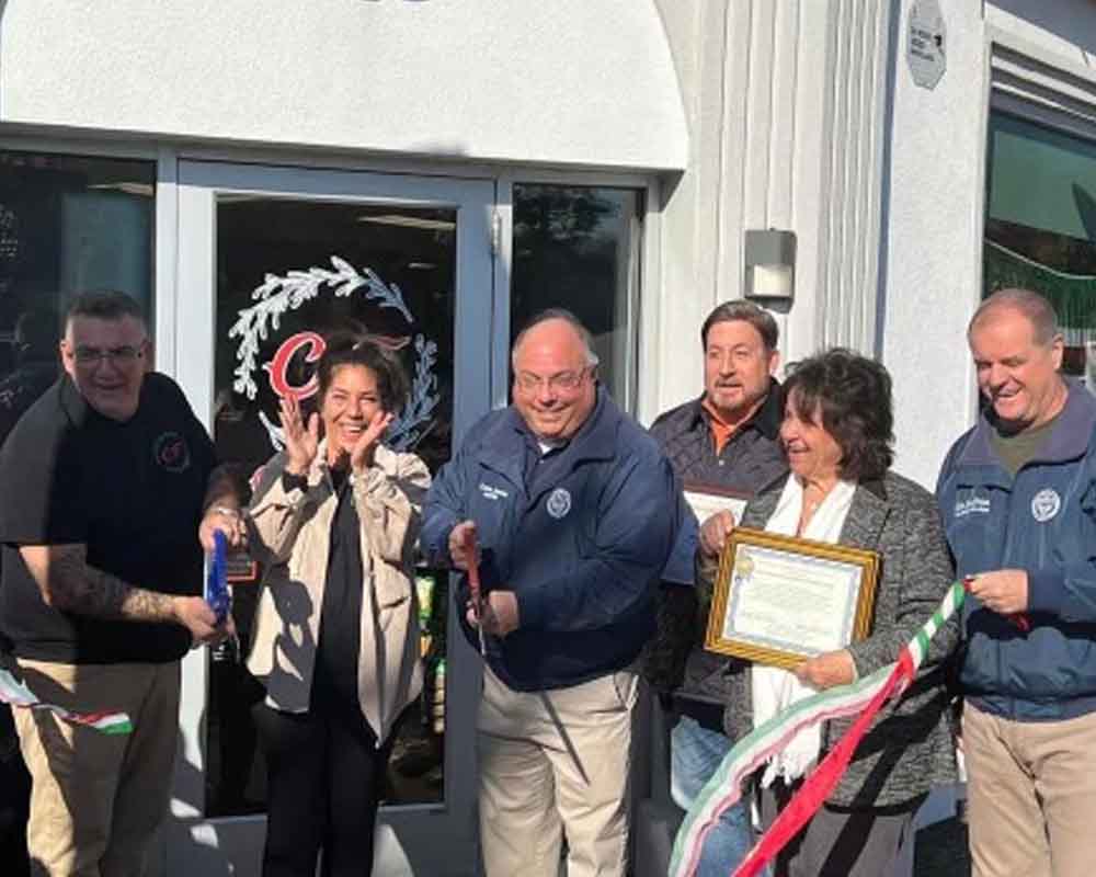 Mayor Carmen Amato joins township officials for the grand opening of Cucina Fresca.