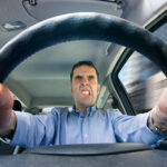 Driver engaging in road rage - Stock Photo