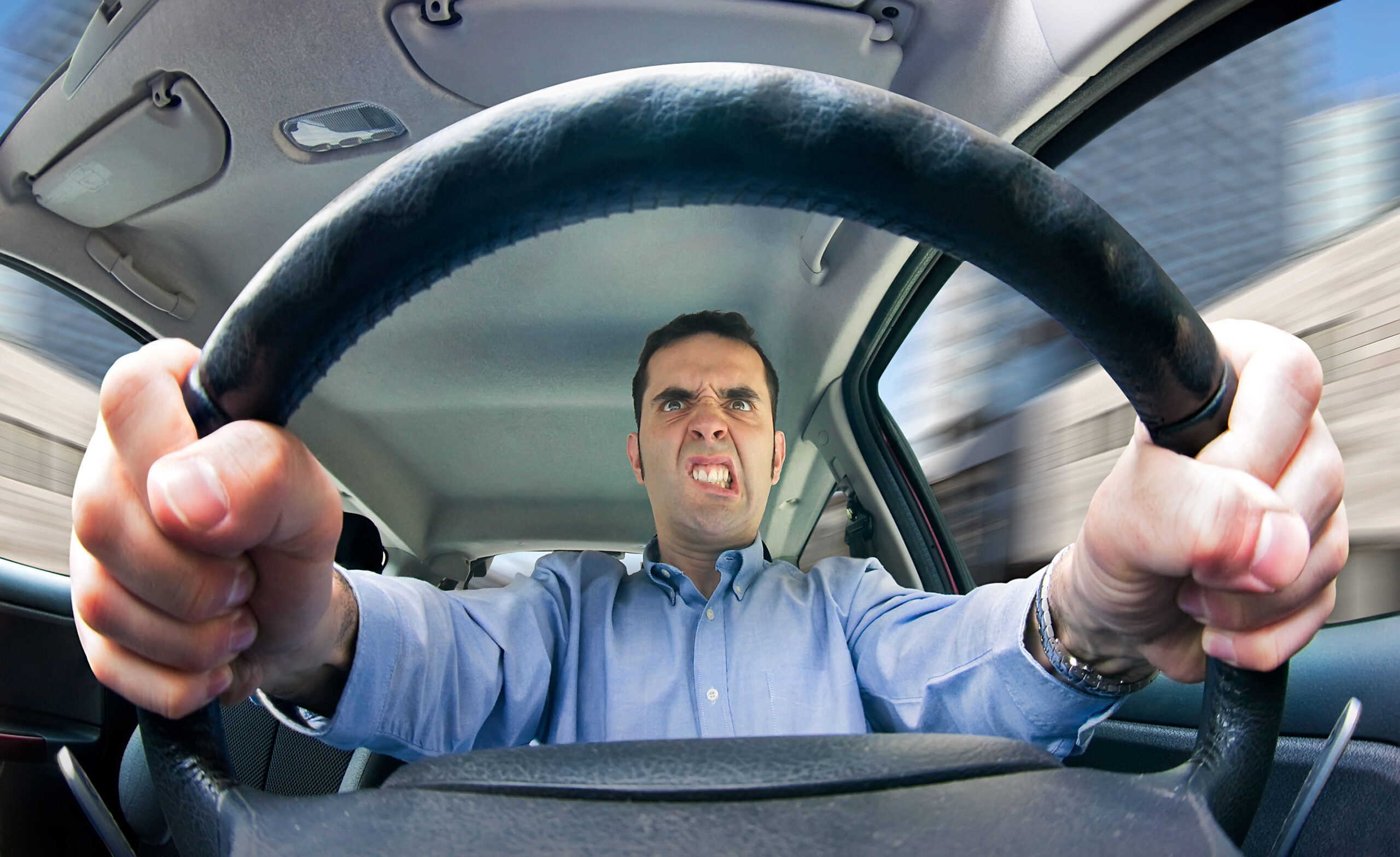 Driver engaging in road rage - Stock Photo