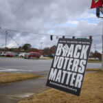 Augusta, Ga USA - 12 14 20: It`s about us street sign, on the reverse is Black voters matter