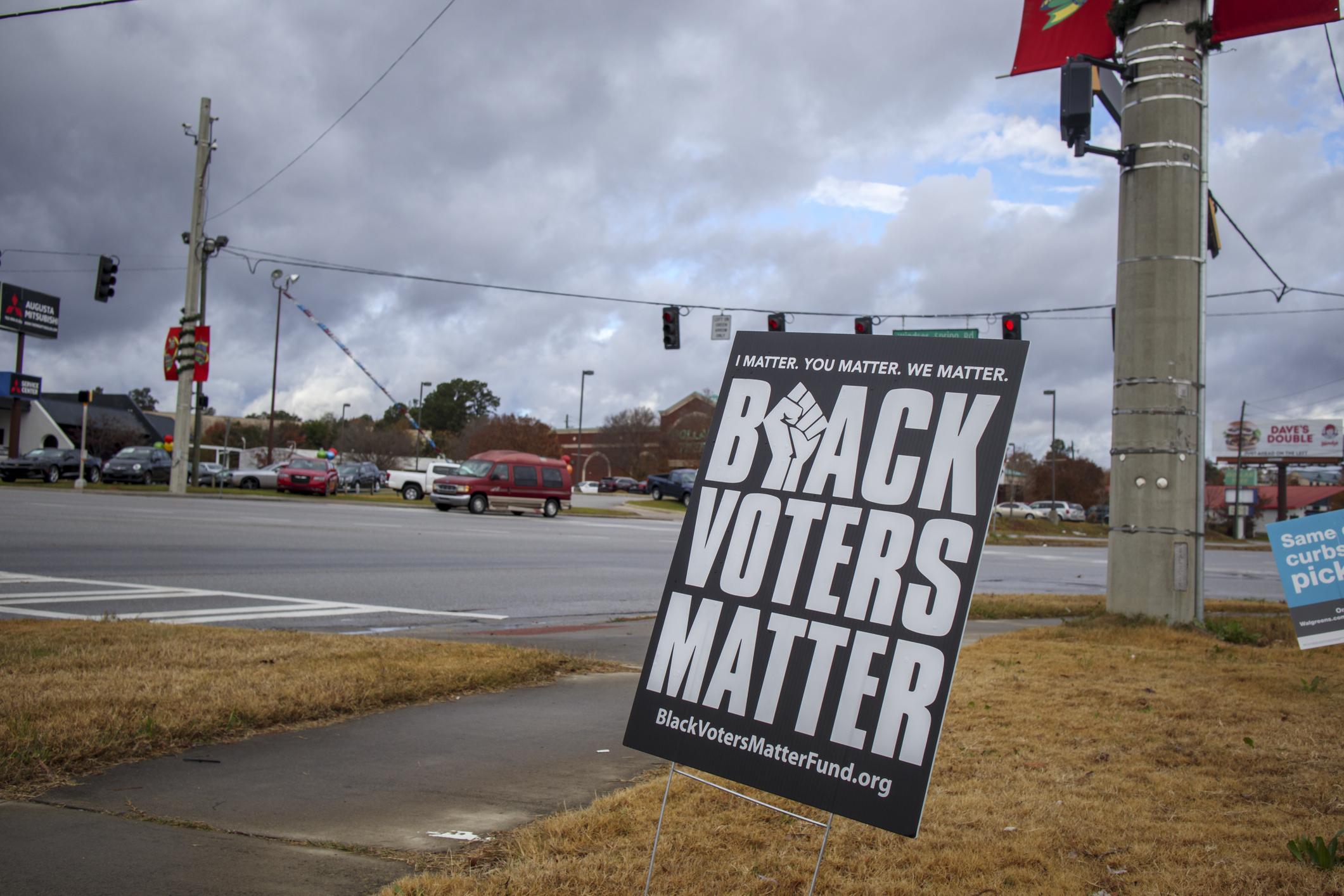 Augusta, Ga USA - 12 14 20: It`s about us street sign, on the reverse is Black voters matter