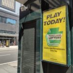 Sign advertising the Pennsylvania Lottery. This photo was taken in Center City, Philadelphia, Pennsylvania, on August 18th 2022.