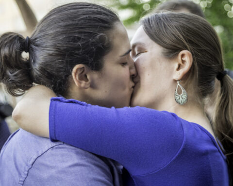 MADISON, WISCONSIN USA - JUNE 6: A lesbian couple getting married on the steps of the City County Building after a judge struck down Wisconsin s gay marriage ban on Friday June 6, 2014 in Madison, WI