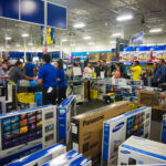 People shopping in a Best Buy store during Black Frida