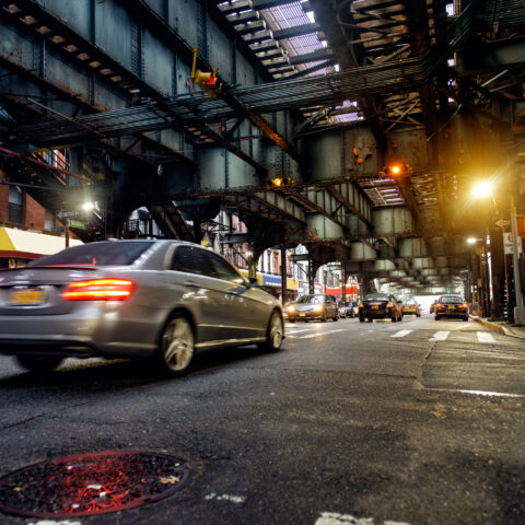 Nyc subway tracks above street in brooklyn.