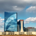 Atlantic City, NJ, December 10, 2016: The Harrah`s hotel and casino is seen under blue sky with clouds.