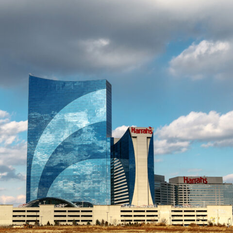 Atlantic city, nj, december 10, 2016: the harrah`s hotel and casino is seen under blue sky with clouds.