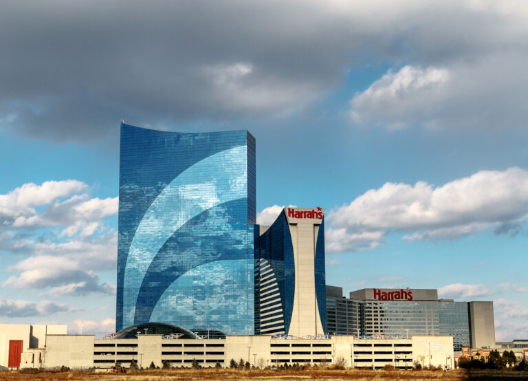 Atlantic City, NJ, December 10, 2016: The Harrah`s hotel and casino is seen under blue sky with clouds.