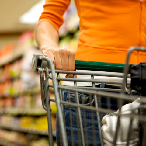 A woman shopping in a supermarket for groceries