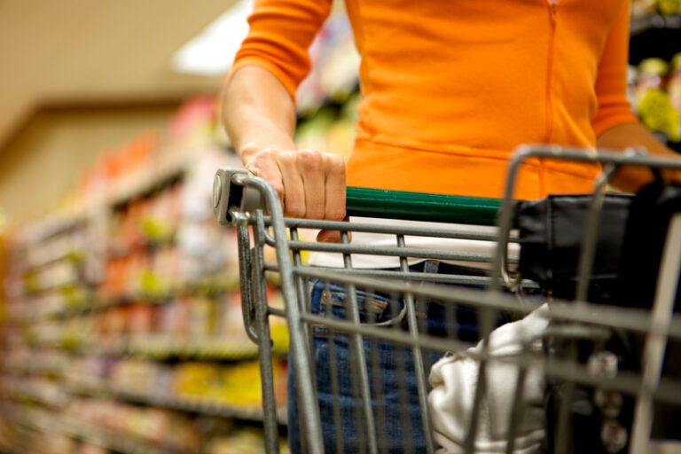 A woman shopping in a supermarket for groceries