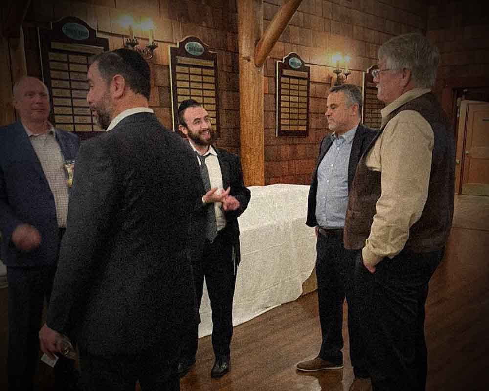 Jackson Township Councilman Marty Flemming speaks with Lakewood Developer Mordechai Eichorn and Jackson VAAD leader Mordechai Burnstein at a campaign fundraiser held at Eichorn's golf course.
