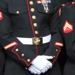 U.S. Marine in dress blues uniform.