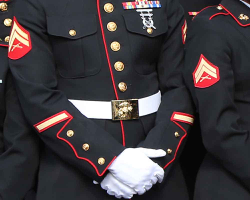 U.S. Marine in dress blues uniform.