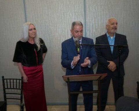 Jackson Township Mayor Michael Reina speaks before supporters alongside Councilwoman-elect Jennifer Kuhn and Councilman-elect Scott Sargent.