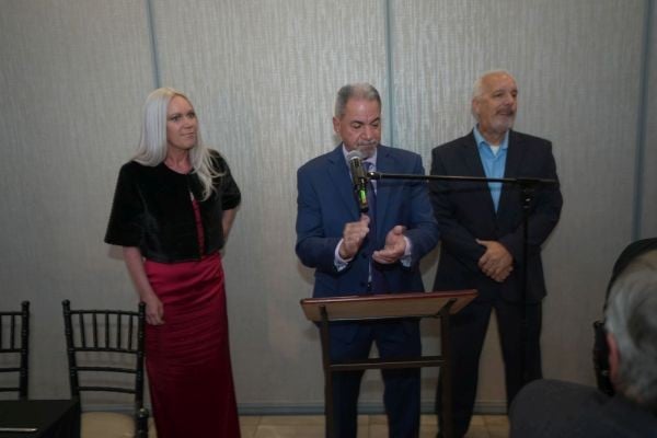 Jackson Township Mayor Michael Reina speaks before supporters alongside Councilwoman-elect Jennifer Kuhn and Councilman-elect Scott Sargent.