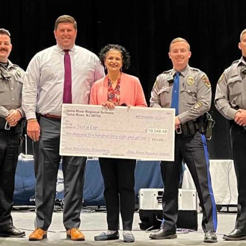 Toms river police department receives $10,000 check from trrs board.