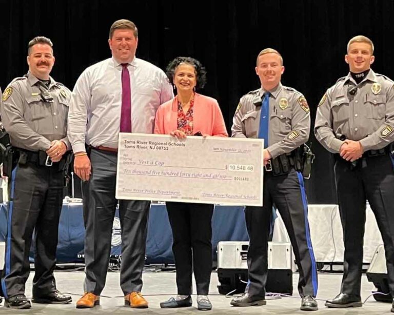 Toms river police department receives $10,000 check from trrs board.