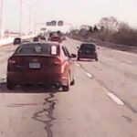 Detectives have released dash camera video of a red four-door sedan that was involved in a shooting on I-70 near downtown Columbus on December 9, 2022.