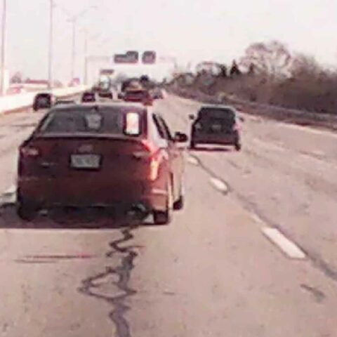 Detectives have released dash camera video of a red four-door sedan that was involved in a shooting on i-70 near downtown columbus on december 9, 2022.