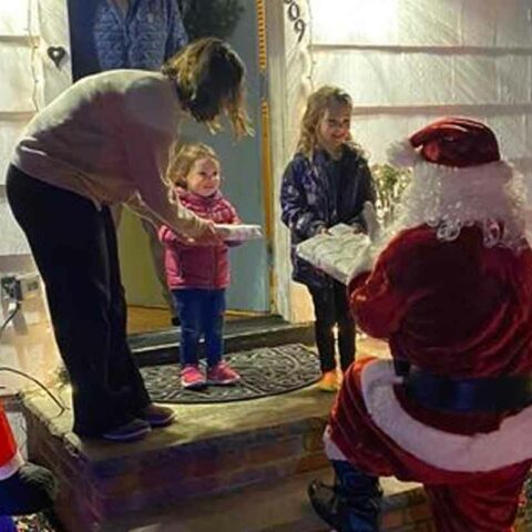 Santa delivers toys to children in cranford.