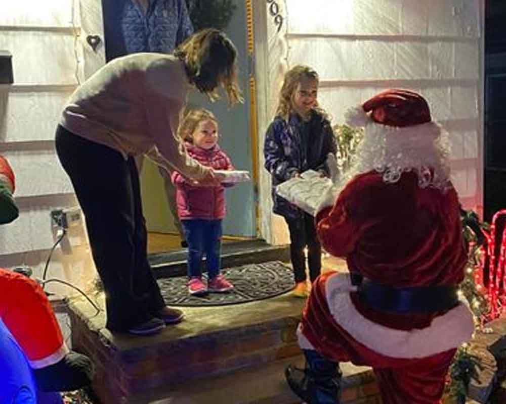 Santa delivers toys to children in Cranford.