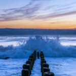 Beautiful ocean waves during sunrise under colorful sky at Bay Head, New Jersey