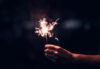 Hand holding sparkler - file photo