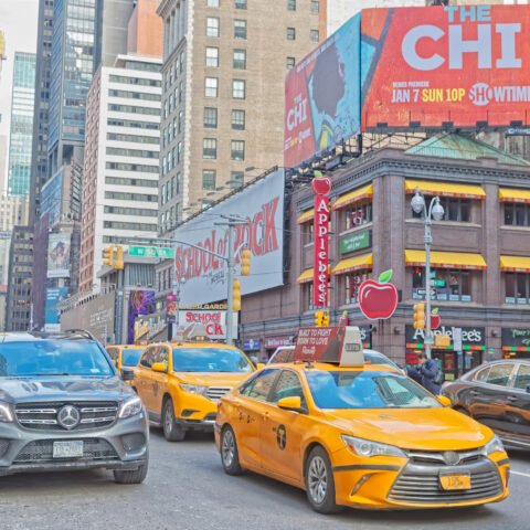 Traffic at broadway and 50th street on sunny winter day, manhattan new york city usa.