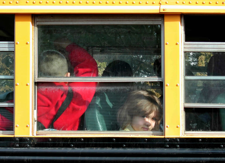 Children on a public school bus.