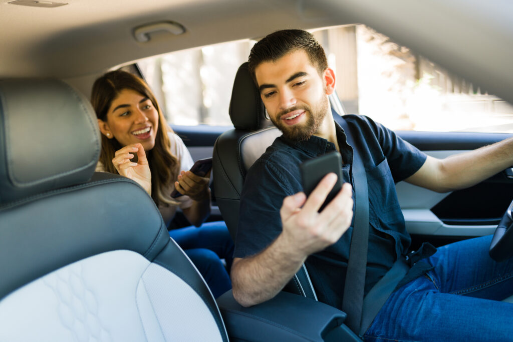 Male rideshare driver picks up female customer.