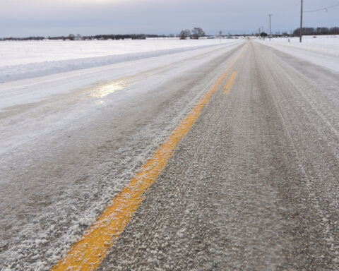 Close up of Slippery Icy Slushy Pavement Road in Winter