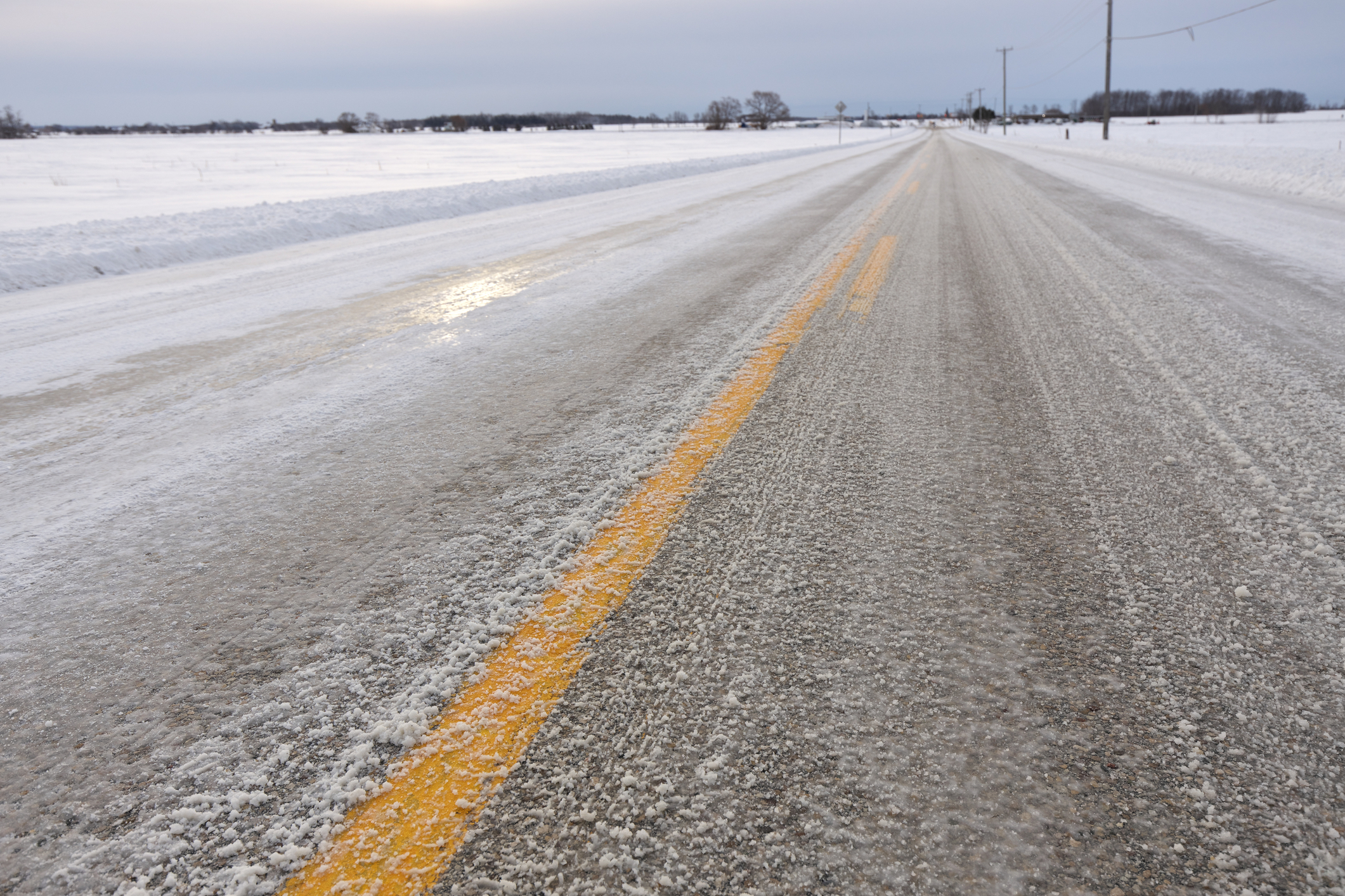 Close up of Slippery Icy Slushy Pavement Road in Winter