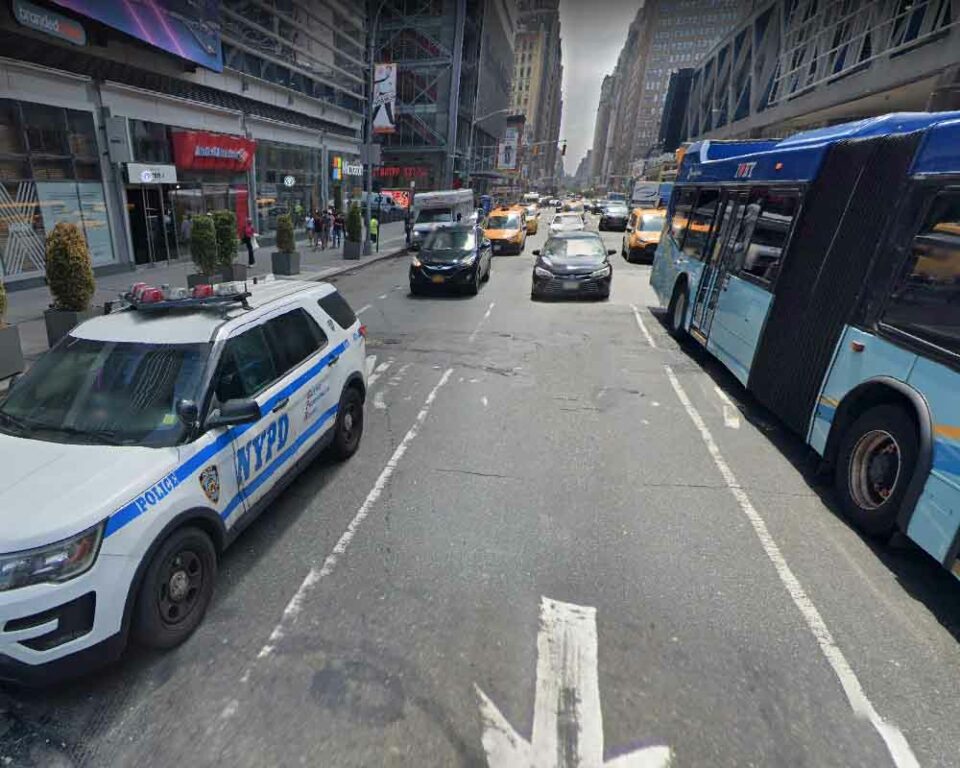 NYPD cruiser and port authority bus outside Manhattan's Port Authority bus terminal
