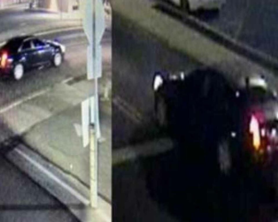 The vehicle that struck the pedestrian is a newer model black Cadillac with tinted windows.
