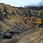 Heavy machinery was used to significantly damage a new retaining wall that borders the intersection of South Minisink and Cheesequake Road.