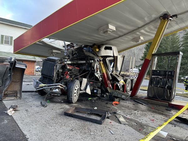 Big rig crashes into gas station causing roof collapse