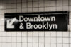 Downtown & brooklyn sign in a subway station in manhattan, new york city