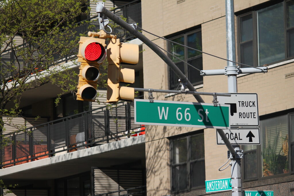 West 66th Street green traffic sign in New York