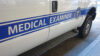 A white ban with the logo of the Medical Examiner of the City of New York.
