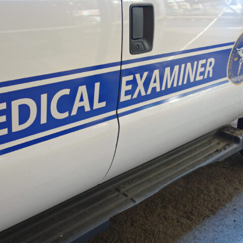 A white ban with the logo of the medical examiner of the city of new york.