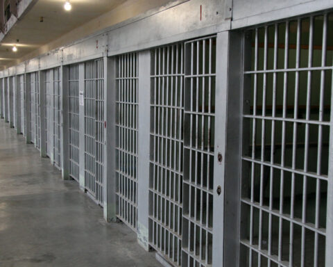 Row of prison cells in a cell block