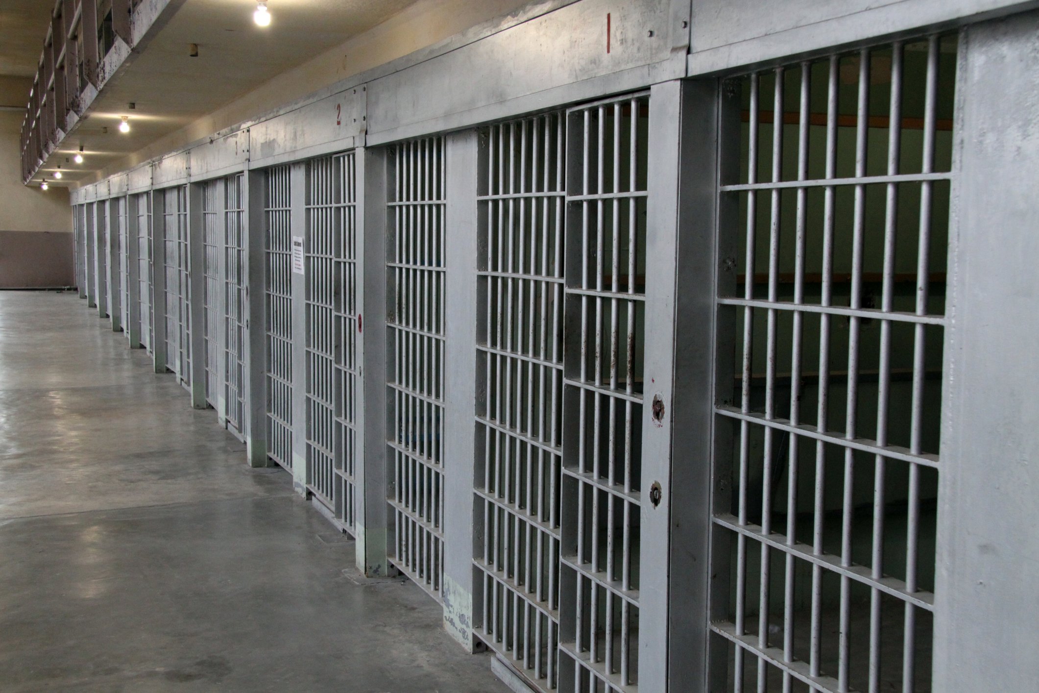 Row of prison cells in a cell block
