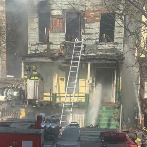 Firefighters at three-alarm fire in the bronx - photo licensed by shore news network.