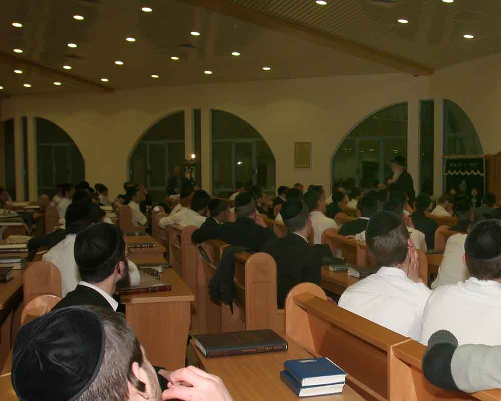 Men study and pray at Orthodox Jewish Yeshiva